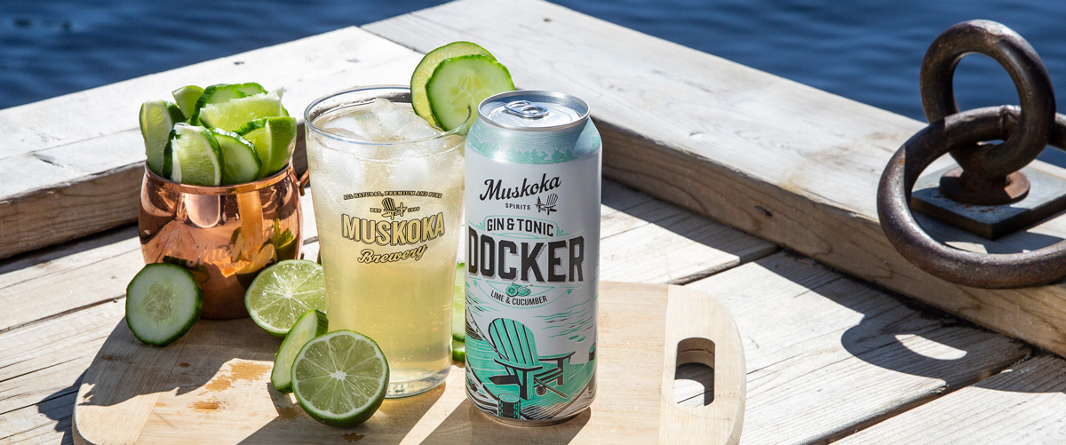 Docker with cucumber, lime, glass and can.
