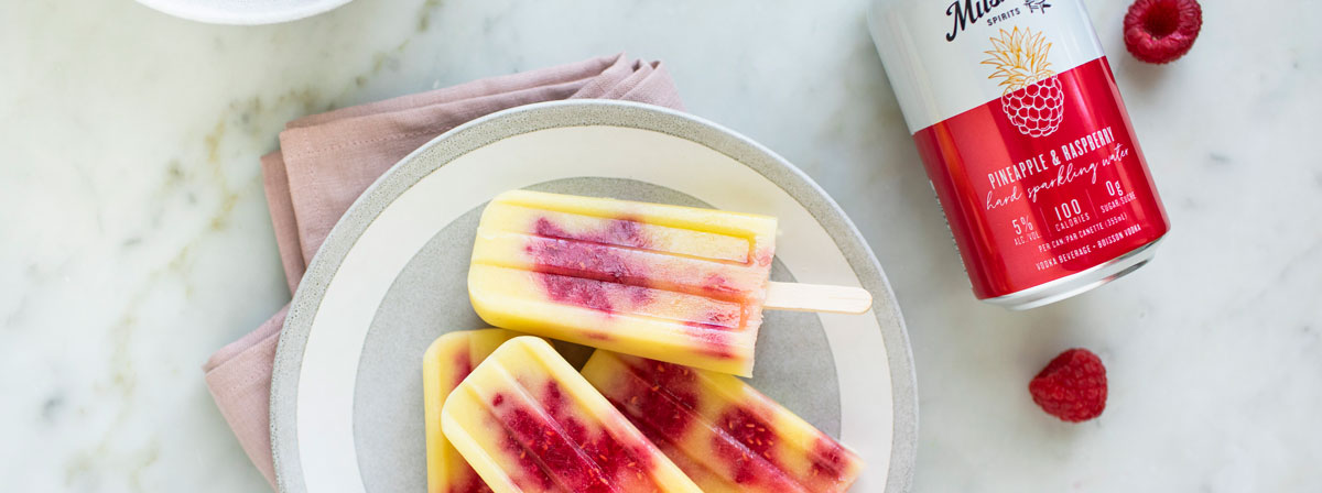 Plate of Raspberry and lemon popsicles, can of Rapsberry Lemon Hard Sparkling Water