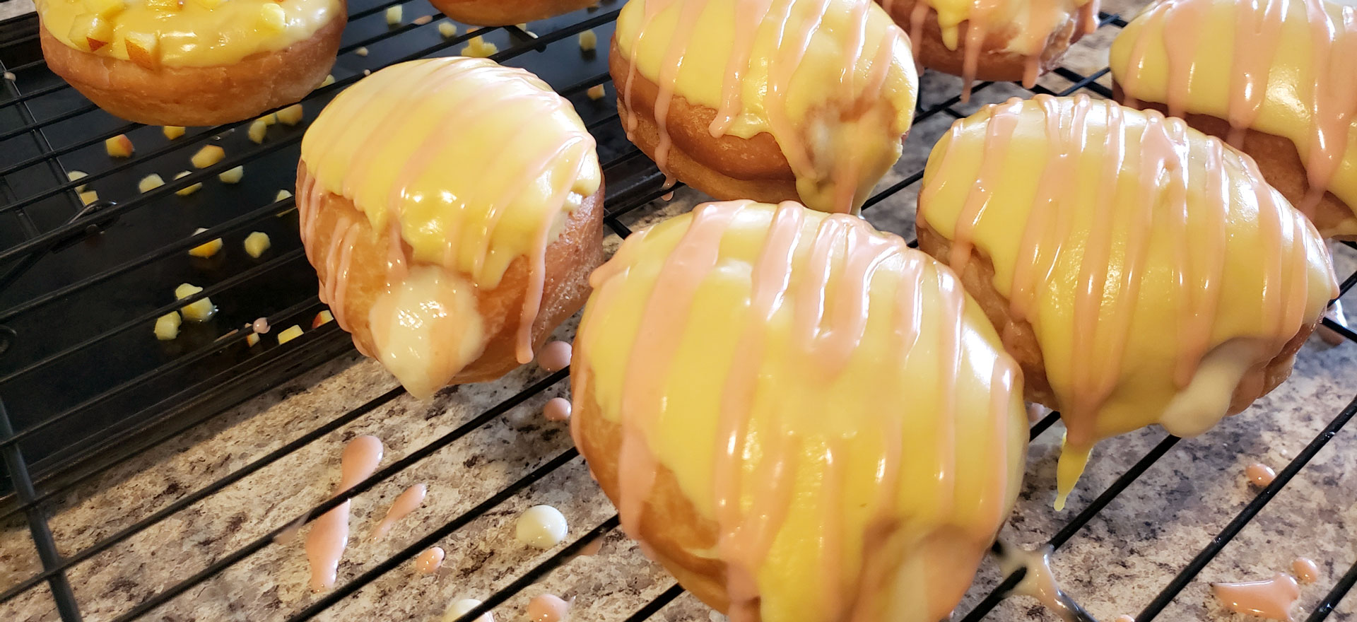 Pastry cream donut with cream and pink frosting